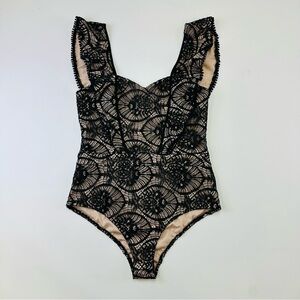 Tea & Cup NWT black lace nude bodysuit Fits Medium ruffles
Romantic